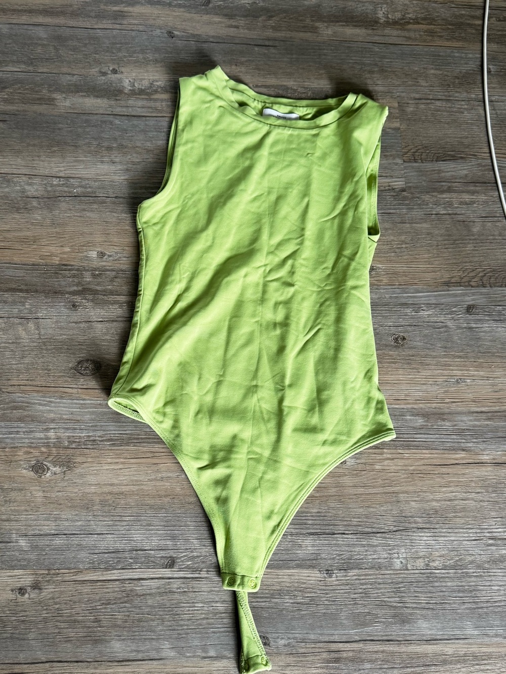 Babaton Contour Muscle Bodysuit in lime green colour. Size S